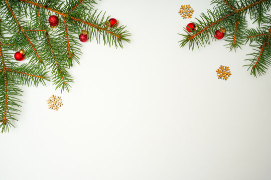Chrismas holiday decoration with fir branches on white background.