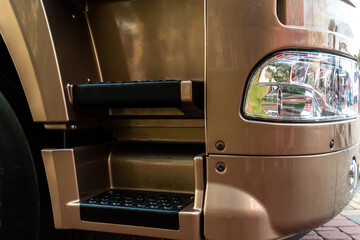 A big truck on the road. Modern new halogen headlights on a truck. Truck headlights.  Square red...