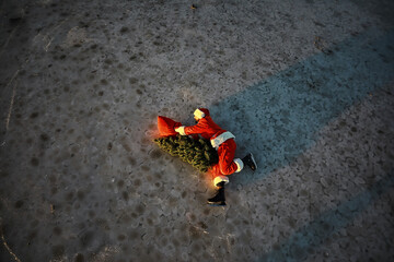 Santa Claus hurries to meet the New Year with gifts and Christmas tree. Santa Claus on ice skates...