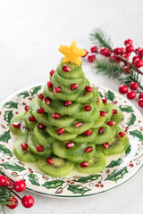 Christmas tree fruit salad with kiwi and pomegranate