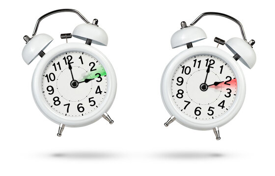 Change Time. Winter And Summer Time Concept Isolated On White Background. Change The Time In Spring And Autumn, A White Alarm Clock Indicates A Change In Time One Hour Ago, One Hour Ahead