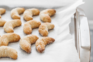 Hot tasty cookies on a baking sheet.