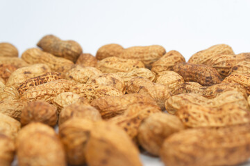 Photo of a bunch of peanuts. Isolated on white background.