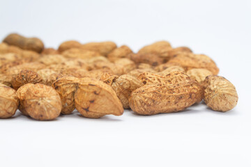 Photo of a bunch of peanuts. Isolated on white background.