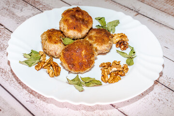 Minced pork chops fried in a pan.