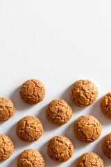 homemade amaretti cookies with cracks on a light background copy space vertical