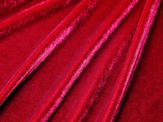 Fototapeta na wymiar Red velvet fabric texture used as background. Empty red fabric background of soft and smooth textile material. There is space for text.