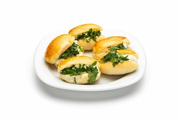 Isolated shot of a plate of pastry sandwiches on a white background
