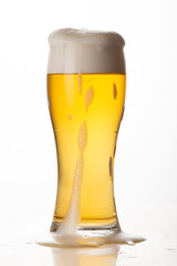 Glass of light beer isolated on white background, foam, bubbles, close-up