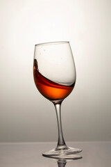 falling glass with red wine, motion blur, blur
