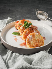 Cottage cheese pancakes, syrniki, curd fritters with berries