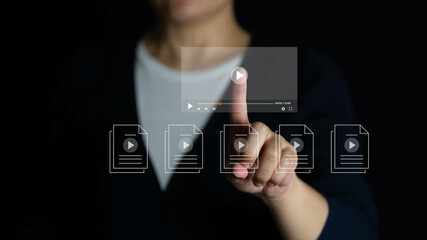 Finger presses the touch screen button to stream online on a virtual screen. Watch videos on the...