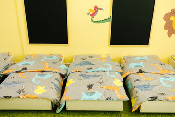 Children's bad in kindergarden. Beautiful kinder room for rest
