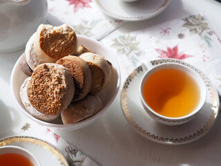 Cup of tea and traditional spanish christmas pastry: polvorones, mantecados, estepa
