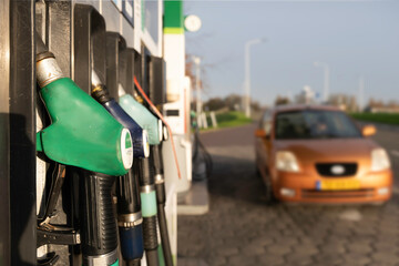 Gas station fuel pumps for different types of gasoline and diesel. Narrow depth of field, focus on...