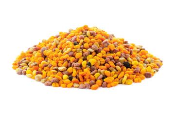 Bee pollen grains isolated on white background. Pile of bee pollen isolated on white background, close-up. Multicolored bee pollen isolated on white background. Natural cure for the flu.