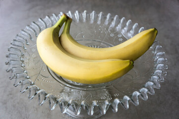 Bananas on an antique glass vase