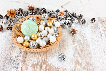 Christmas decoration in a wicker plate with straw free space