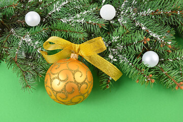 Christmas golden toy on a green background horizontal