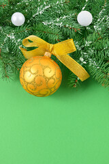 Christmas golden toy on a green background