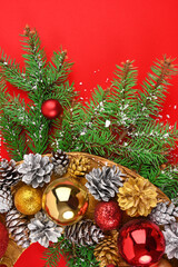 Christmas wreath on a red background fragment vertical