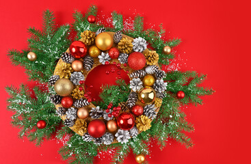 Christmas wreath on a red background