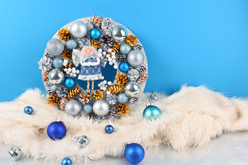 Christmas wreath with an angel on a blue background