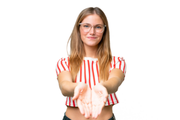 Young beautiful woman over isolated background holding copyspace imaginary on the palm to insert an ad