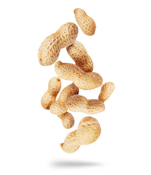 Dried peanuts close-up in the air isolated on a white background