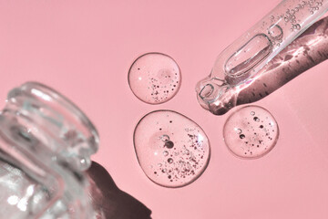 Close up of glass bottle and pipette with fluid collagen and hyaluronic acid, hydration skin with...
