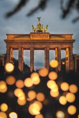 Vertical shot of Brandenburger Gate with Christmas lights. Berlin, Germany. © Nicolai Duda/Wirestock Creators