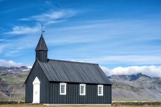 Luther church in a green field in Iceland made of wood