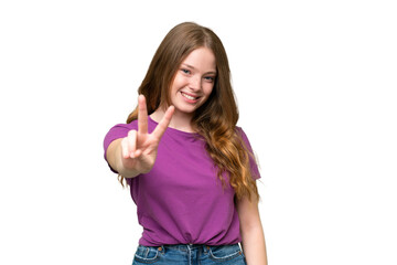 Young pretty woman over isolated background smiling and showing victory sign