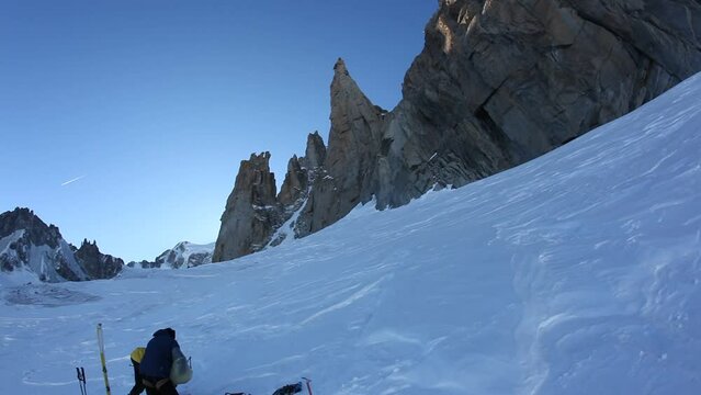 A team of climbers is preparing the start of a mountaineering climb. Glacier du Geant,  Mont Blanc, Chamonix, France.