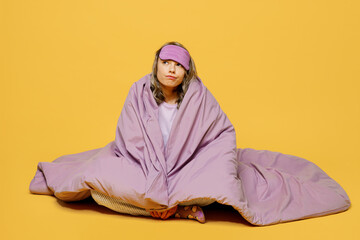 Full body young minded woman she wearing purple pyjamas jam sleep eye mask rest relax at home sit...