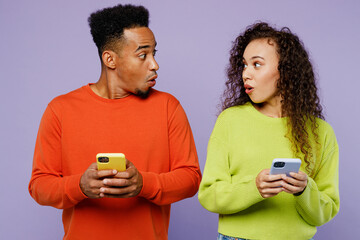 Young amazed couple two friends family man woman of African American ethnicity wear casual clothes...