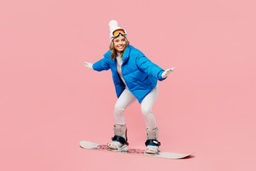 Side view snowboarder sportive fun woman wear blue suit goggles mask hat ski padded jacket...