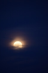 selective focus picture of moon and clouds