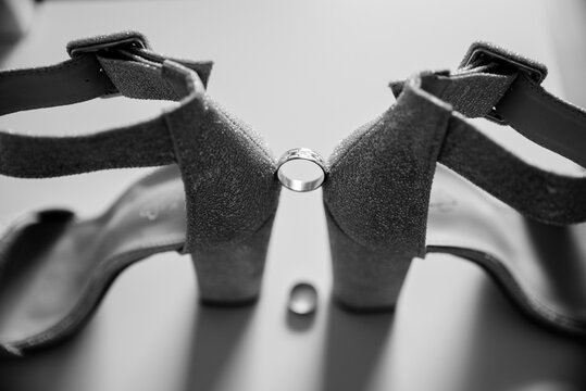 Wedding shoes, wedding ring - Powered by Adobe