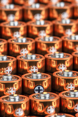 Row of alkaline battery size AA in perspective closeup view