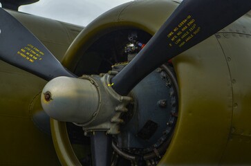 Engine and propeller of an old airplane exposed outdoors