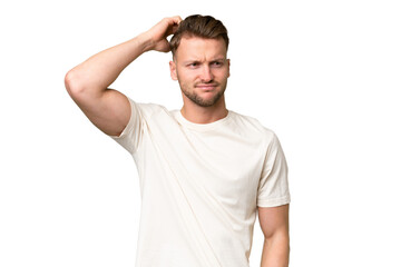 Young blonde caucasian man over isolated background having doubts while scratching head