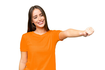 Young pretty caucasian woman over isolated background giving a thumbs up gesture