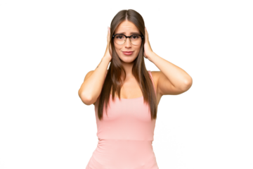 Young pretty caucasian woman over isolated background frustrated and covering ears