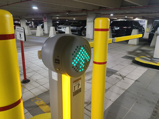 The front side of a yellow plastic parking barrier gate at the Parking Garage for the McNamara...