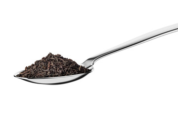 Teaspoon with black dry tea leaves isolated on white.
