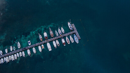 aerial imagery 4k of land and sea with boats
