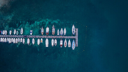 aerial imagery 4k of land and sea with boats