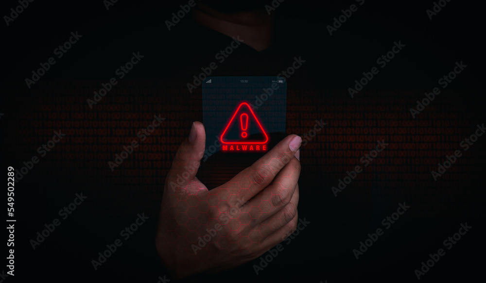Poster malware concept. red malware icon alert on futuristic transparent smart mobile phone in businessman 