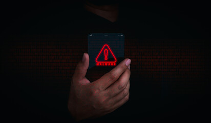 Malware concept. Red malware icon alert on futuristic transparent smart mobile phone in businessman...